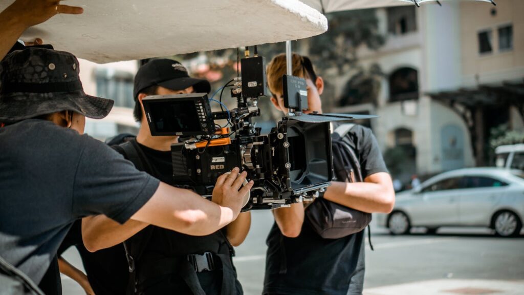 photo of man holding a camera